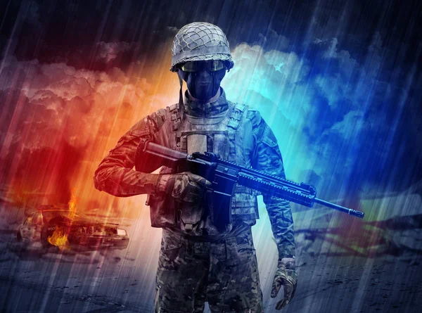 Armed soldier standing in the middle of dust storm — Stock Photo, Image