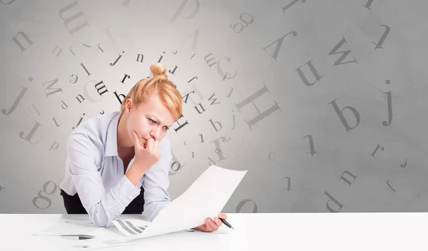 Business person sitting at desk with editorial concept — Stock Photo, Image