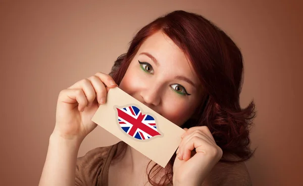 Person holding UK flag card