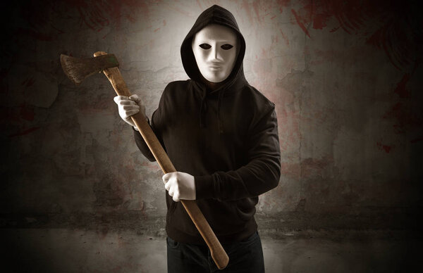 Armed assassin in an empty bloody room concept