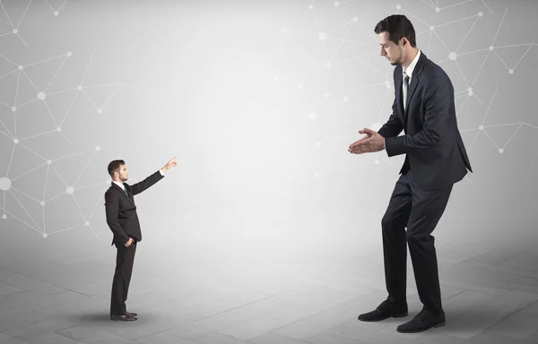 Small man aiming at a big man with network concept — Stock Photo, Image