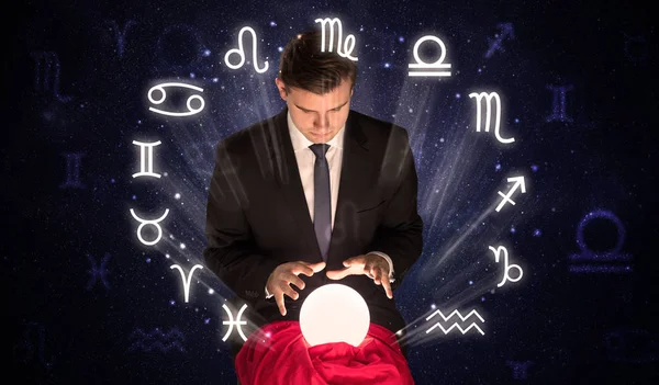 Astronaut looking for inspiration in his crystal magic ball — Stock Photo, Image