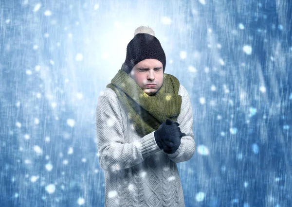 Handsome boy shivering at snowstorm concept Stock Image