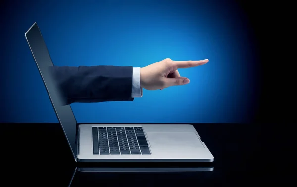 Hand coming out of a laptop — Stock Photo, Image