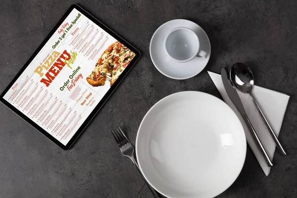 Online pizza menu with tableware concept — Stock Photo, Image