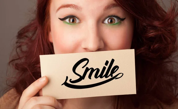 Person holding card with smile — Stock Photo, Image