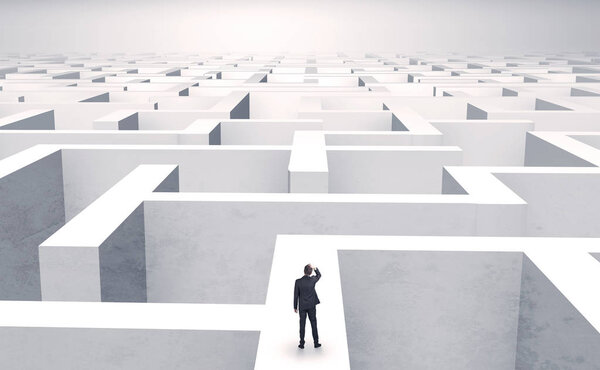 Small businessman in a middle of a maze