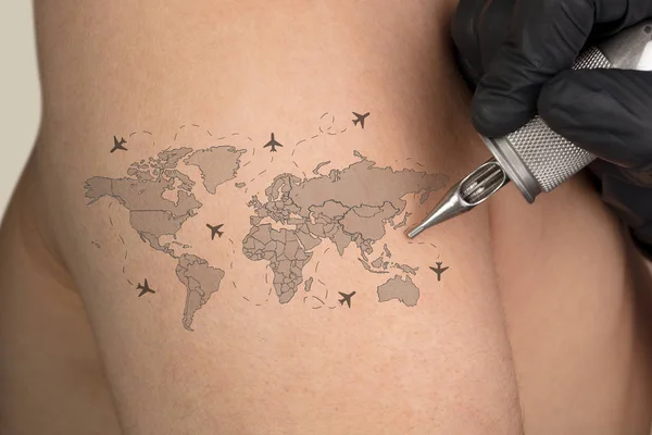 Tattooing traveling concept on naked back