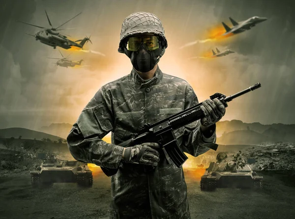 Armed soldier standing in the middle of a war — Stock Photo, Image