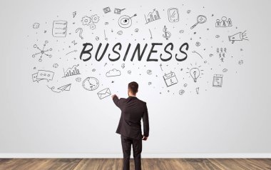 Yöneticisi iş kavramı ile bir duvara bakarak şüphe