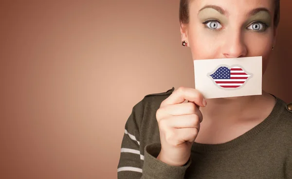 Person holding USA flag card