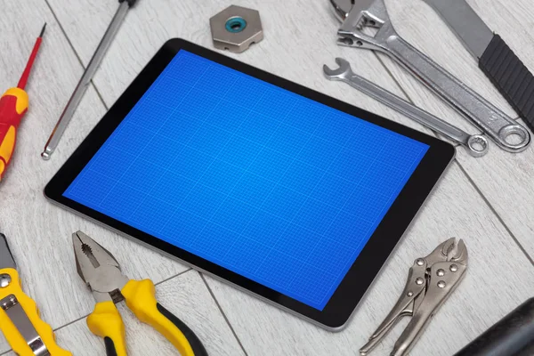 Tablet s nástroji a mřížky obrazovky koncepce — Stock fotografie