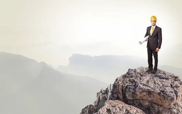 Business person on the top of the rock — Stock Photo, Image