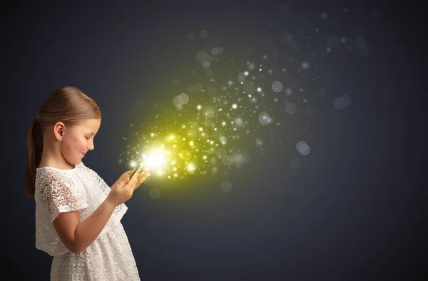 Little kid playing on sparkling tablet — Stock Photo, Image