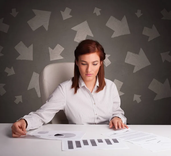 Manager in front of the office desk with direction concept — Stock Photo, Image