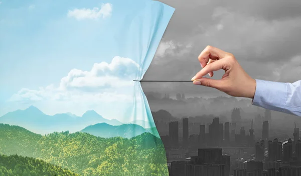 Hand pulling nature cityscape curtain to gray cityscape — Stock Photo, Image