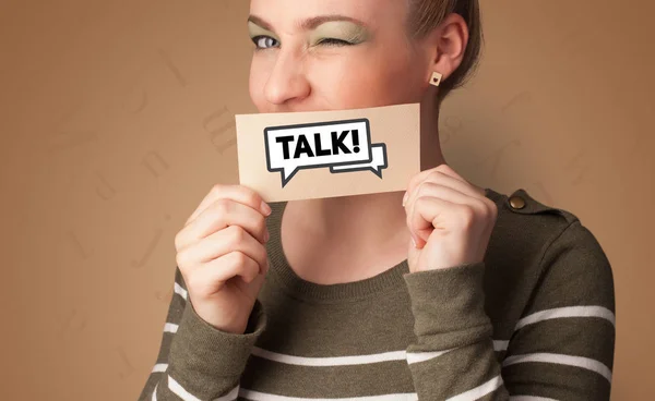 Persona con tarjeta delante de su boca — Foto de Stock