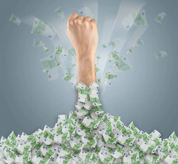 Hand buried in cash pile and trying to get out — Stock Photo, Image