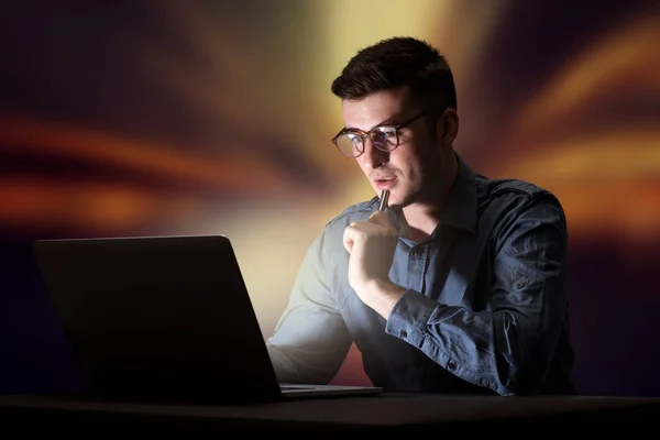 Businessman in the office at night — Stock Photo, Image