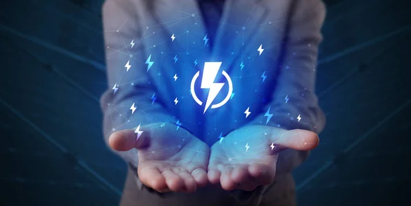 Hand holding lightning bolt — Stock Photo, Image