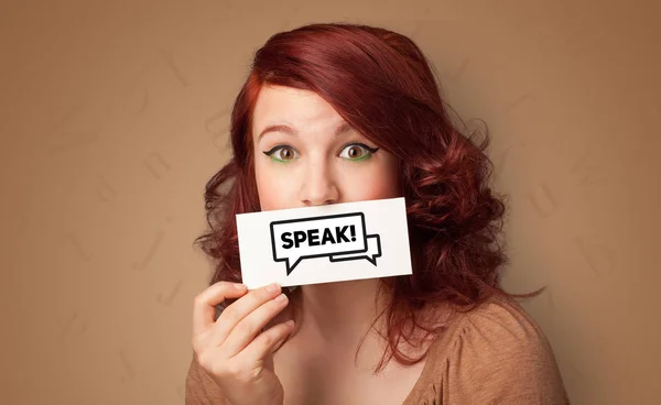 Person holding card in front of his mouth