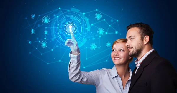 Man and woman touching hologram security symbol — Stock Photo, Image
