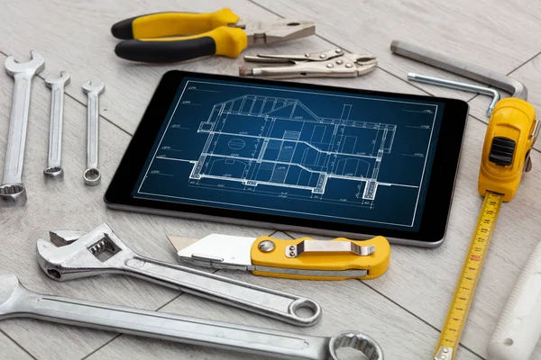 Tablet and tools with blueprint concept — Stock Photo, Image