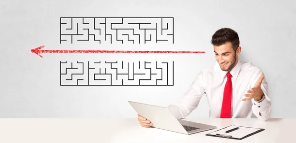 Businessman presenting maze — Stock Photo, Image