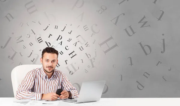 Business person sitting at desk with editorial concept — Stock Photo, Image