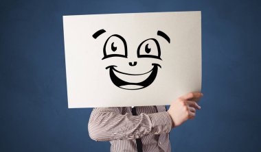 Bir kağıt doodle ifade yüzünün önünde tutan kişi