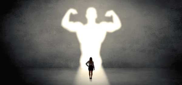 Woman standing in front of a strong hero vision — Stock Photo, Image
