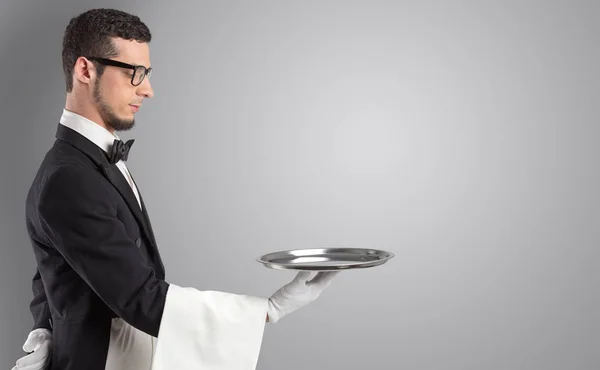 Waiter serving with white gloves and steel tray — Stock Photo, Image