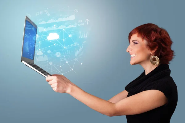 Woman holding laptop with cloud based system concept — Stock Photo, Image