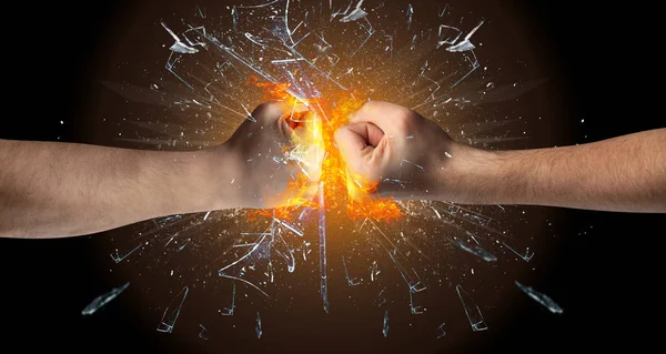 Fighting hands breaking glass — Stock Photo, Image