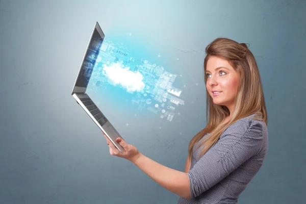 Woman holding laptop with cloud based system notifications — Stock Photo, Image