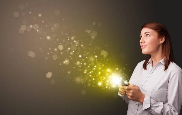 Using phone with gold sparkling concept — Stock Photo, Image