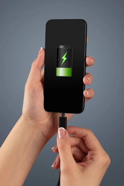 Hand charging phone with low battery