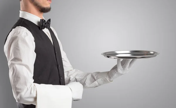 Waiter serving with white gloves and steel tray — Stock Photo, Image