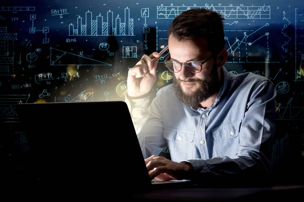 Businessman in the office at night — Stock Photo, Image