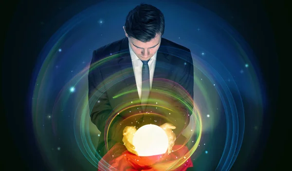 Man looking to the future of the word in a magic ball — Stock Photo, Image