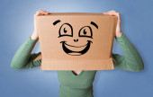 Young woman with cardboard box on her head