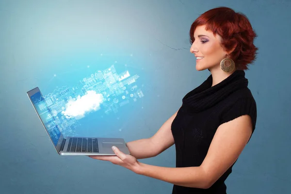 Woman holding laptop with cloud based system notifications — Stock Photo, Image