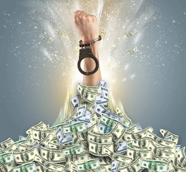 Hand bursting from a money heap — Stock Photo, Image