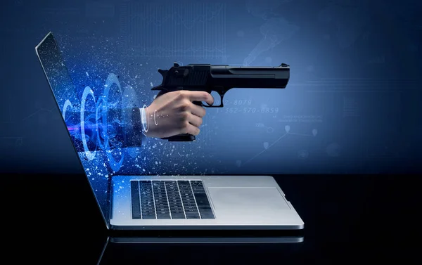 Hand mit Waffe aus Laptop — Stockfoto