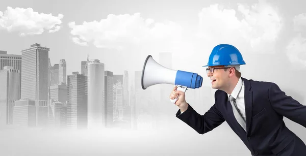 Architect standing and yelling to far big city panorama — Stock Photo, Image