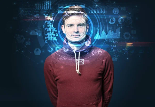 Young man on dark background, face recognition concept
