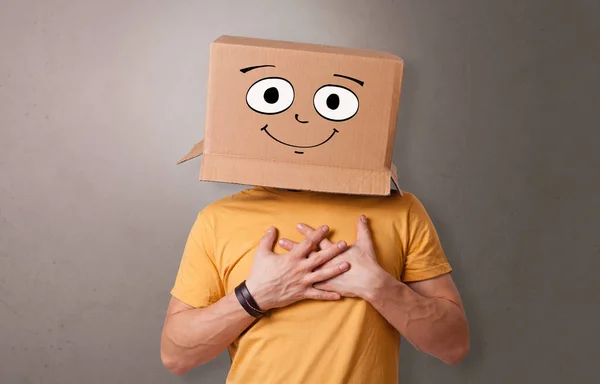 Young boy with happy cardboard box face — Stock Image Young boy with happy cardboard box face Stock Photo