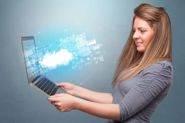 Woman holding laptop with cloud based system notifications — Stock Photo, Image