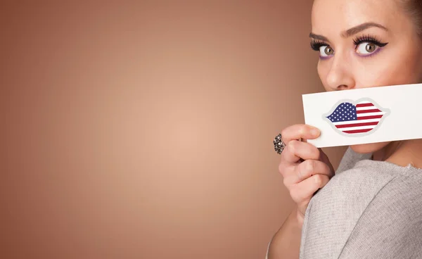 Person holding USA flag card