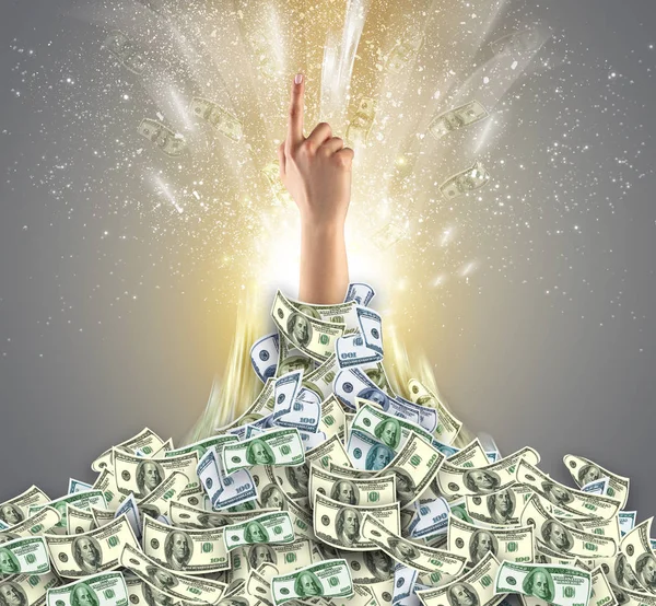 Hand bursting from a money heap — Stock Photo, Image